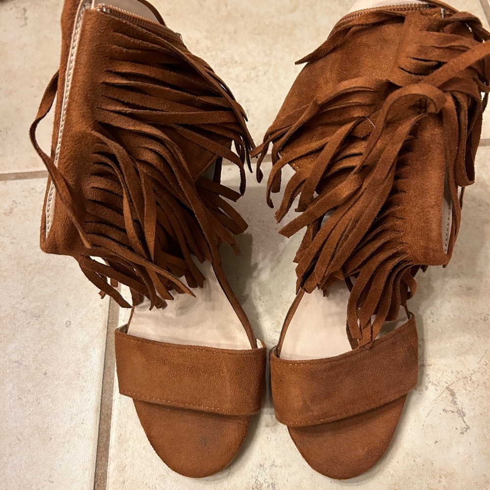 Brown, fringe, wedge shoes.